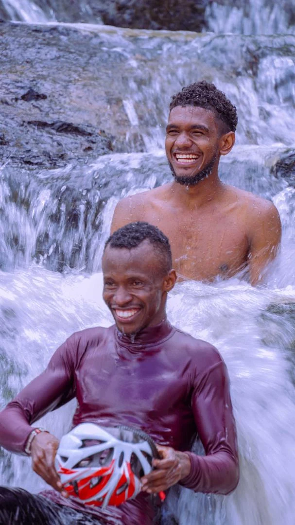 Visitors enjoying flowing water in a natural pool